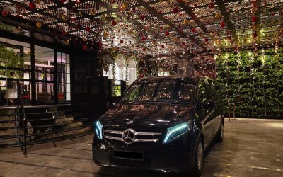 Black Mercedes V-Class luxury car at hotel entrance Singapore
